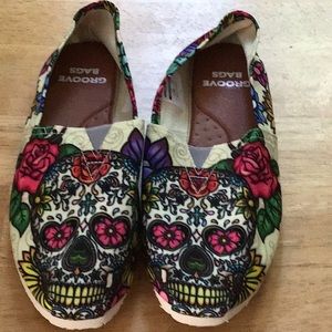 Sugar skull slip on shoes. Never worn. Women’s 9.5